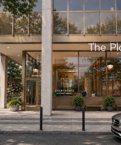 The Plaza building lobby entrance with &ldquo;APARTMENTS&rdquo; signage, trees, a few people chatting, and a parked car in front.